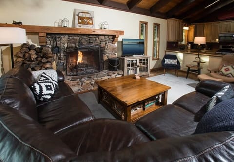 Warm up by the wood fireplace and connect with your group as you relax on the comfortable living room sofa.