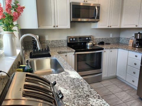 Full kitchen with dishwasher and French door refrigerator