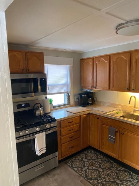 Stove in kitchen. Keurig and drip coffee makers provided