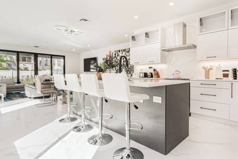 Have a few drinks at the kitchen island while watching the designated chef in action.