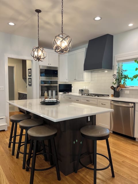 Kitchen island with 5 counter height stools. 