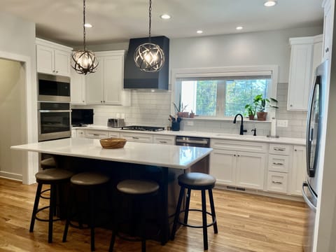 Double ovens, microwave, gas cooktop, dishwasher, large fridge. 