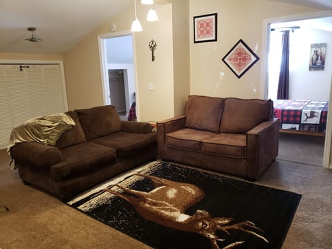 Living room with 2 love seats.