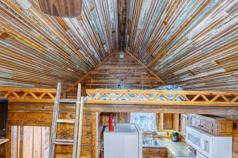 Loft area with a queen size mattress.