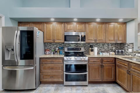 Kitchen with Stainless Ceramic Top Stove