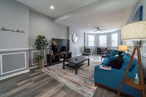 Living Room with a 60" Smart TV. Queen size memory foam sofa sleeper.