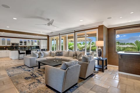 LIVING ROOM TO KITCHEN AND POOL AND YARD