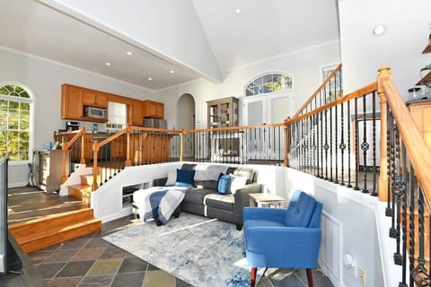 Gather in the living room for cozy evenings overlooking the lake.