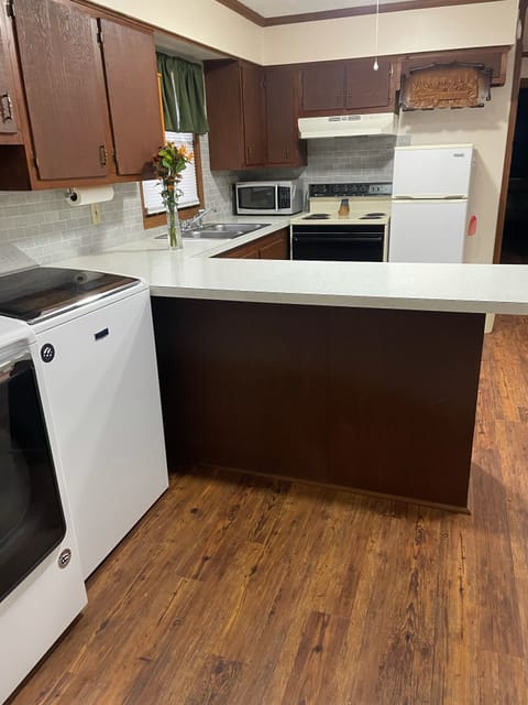 The refrigerator in this picture has been replaced for a a bigger one