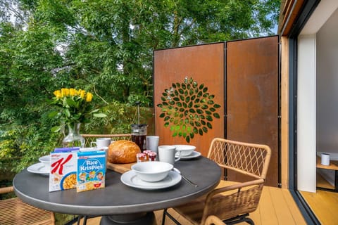 Breakfast is provided and enjoying it on the dining terrace on a sunny day is one of life's simple pleasures.