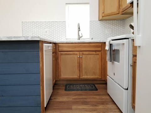 Dishwasher, oven, kitchen sink area