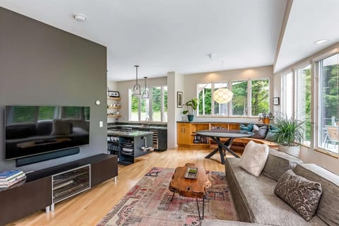 Living room with surround windows.