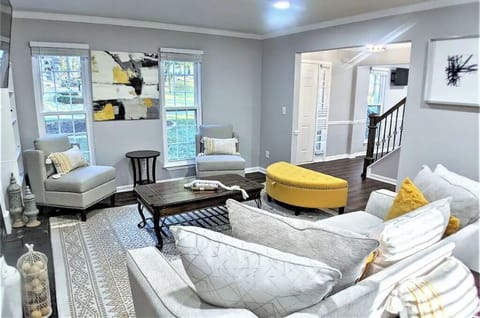 Welcome home to a warm tranquil living room with a 55' TV above the fireplace!