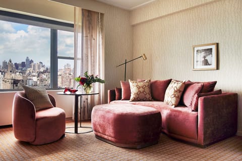 Unwind on plush velvet seating with sweeping skyline views.