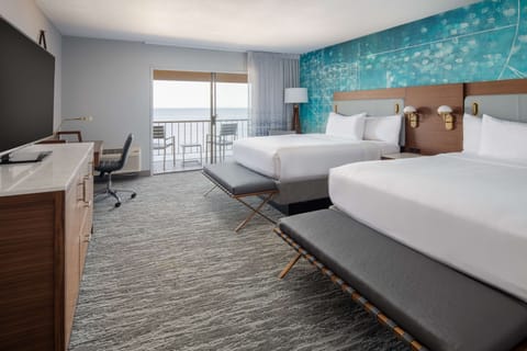 Wake up to ocean views from your airy double room.