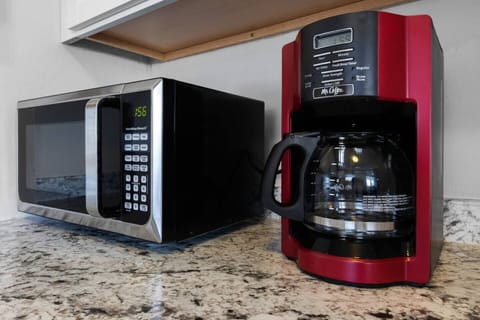 Fully furnished kitchen with dining area seating.