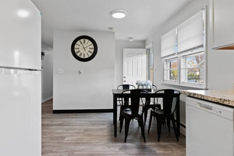 Fully furnished kitchen with dining area seating.