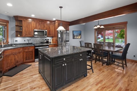 The open concept kitchen fully stocked with cookware, state of the art appliances, and more!