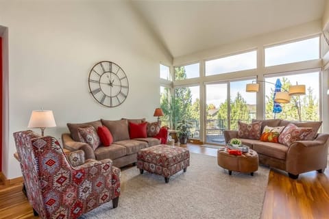 Enter into a bright and airy living room with seating for everyone