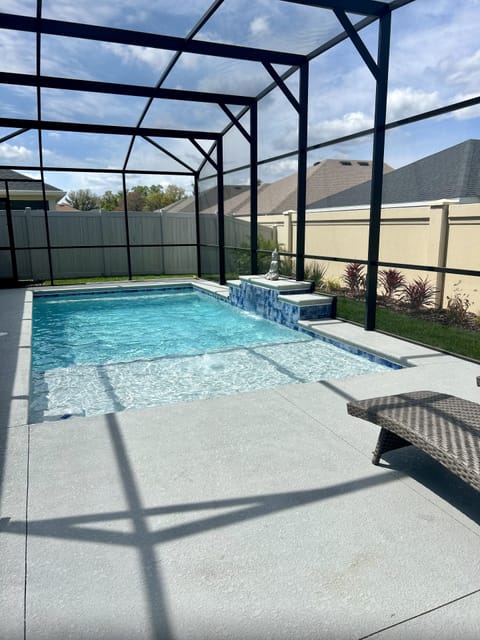 Lanai -heated  pool, sun chairs, flat screen TV, plus sitting and dinning area.