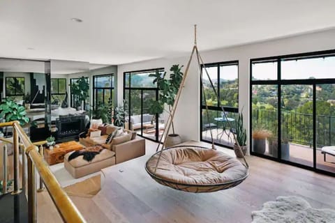 The elevated second living room with 4 person adult swing 
