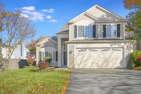 Exterior view of the house - enjoy cornhole and a picnic table in the backyard!
