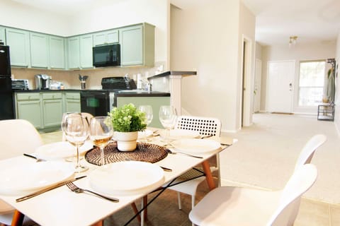 Dining, kitchen, hallway to front door.