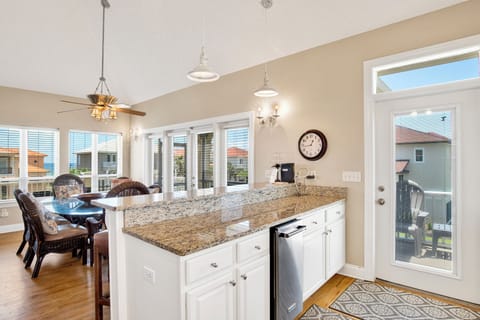 Kitchen bar with seating and a standalone ice maker