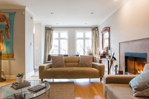 Spacious living room with extra chairs/stools for large groups. 