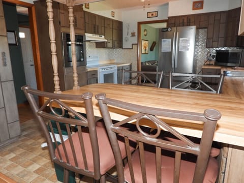 Bar with stools upstairs.