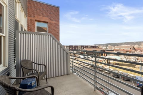 The Patio - view from doorway.  Four chairs and two with cushions.