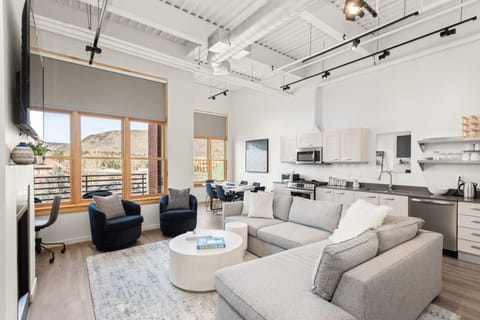 A welcoming, open and comfortable living room with pull out queen couch.