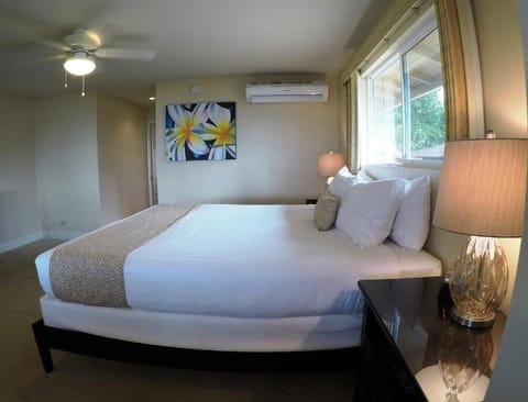 Drift off comfortably in a calm, air-conditioned bedroom retreat.
