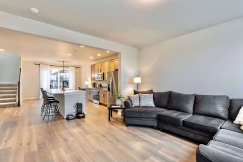 Spacious Living Room with Cozy Seating and Large Windows Unwind in a bright and Airy living space, perfect for relaxation