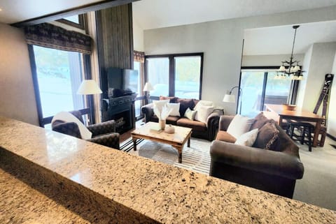 Open, cozy layout with a fireplace