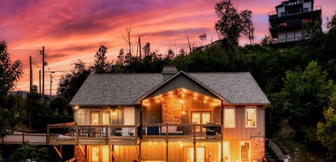 Incredible deck space with hot tub, fire pit, outdoor dining and outdoor games!