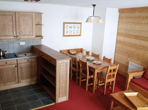 Prepare meals in the kitchenette and enjoy them at the dining table.