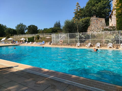 Lounge by the lovely outdoor pool.