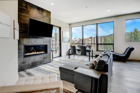 Beautiful Living Room Area With Doublewide Gas Fireplace