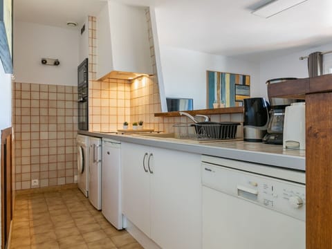 Cabinetry, Countertop, Furniture, Building, Kitchen Appliance, Kitchen, Kitchen Stove, Wood, Lighting