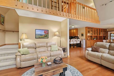 Step into comfort and warmth – our cozy living room welcomes you with a comfy couch, coffee table, a fireplace perfect for gatherings, and a TV for memorable movie nights.