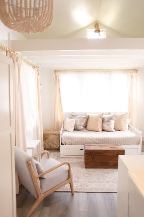 Living room w daybed. Loft above.