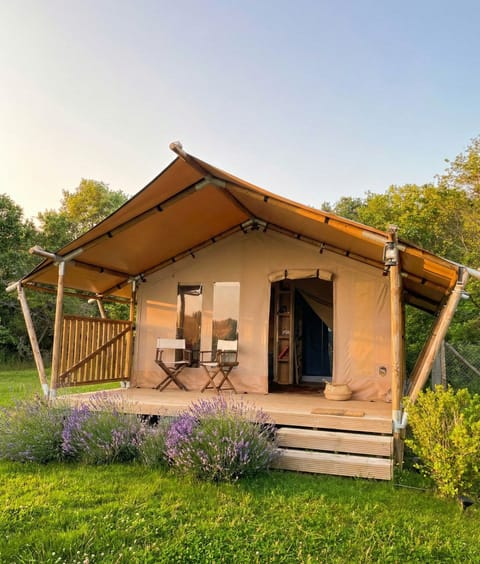 Elegant luxury lodge surrounded by lush greenery, featuring a spacious panoramic veranda overlooking the wilderness. Harmonious architecture and natural materials blend seamlessly with the landscape, creating an exclusive retreat full of charm. Perfect for a high-end wilderness escape defined by privacy, tranquility, and unforgettable sunsets in Italy’s first Wilderness Area.