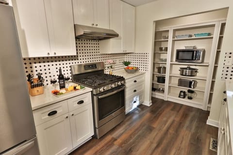 Kitchen with refrigerator, oven, and many other appliances