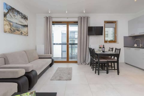 Large table with chairs for eating communal meals.