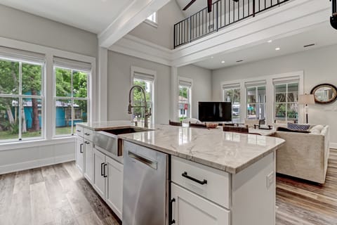 Fully Equipped Gourmet Kitchen with Granite Countertops and Stainless Appliances including a Gas Range