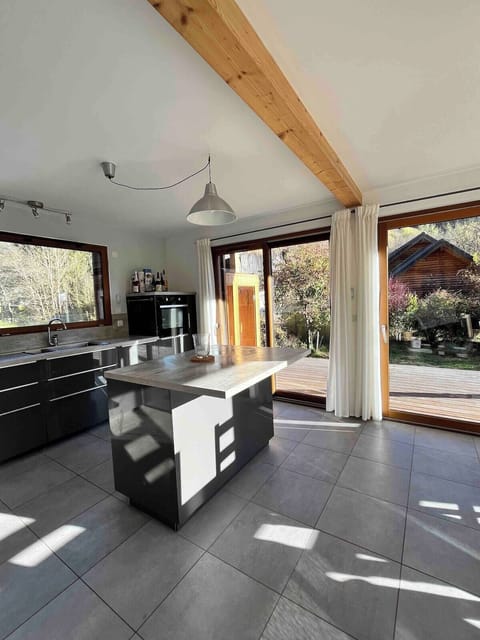 The modern kitchen is spacious and well equipped