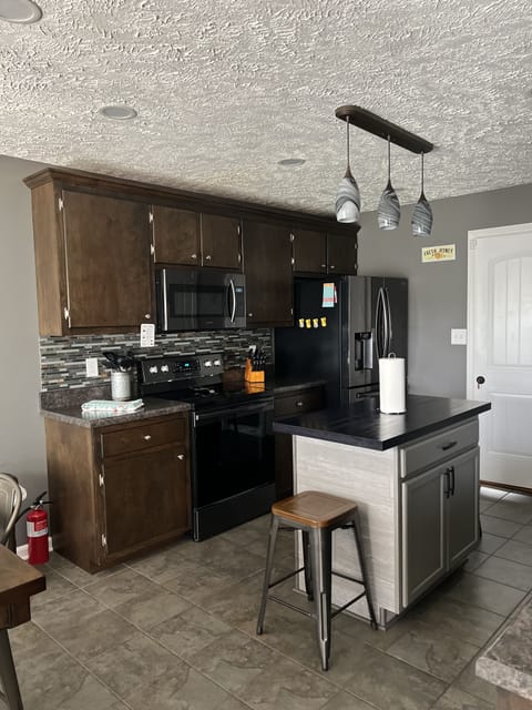 Blender, toaster and Insta-pot can be found in the kitchen island.