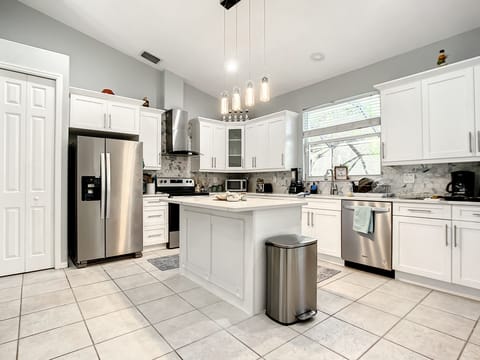 New kitchen with brand-new Appliances, equipment with pots, silverware,plates...