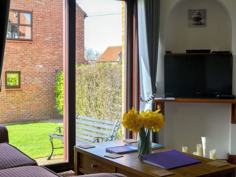 Lounge area with patio doors | Keel Cottage, Whitby